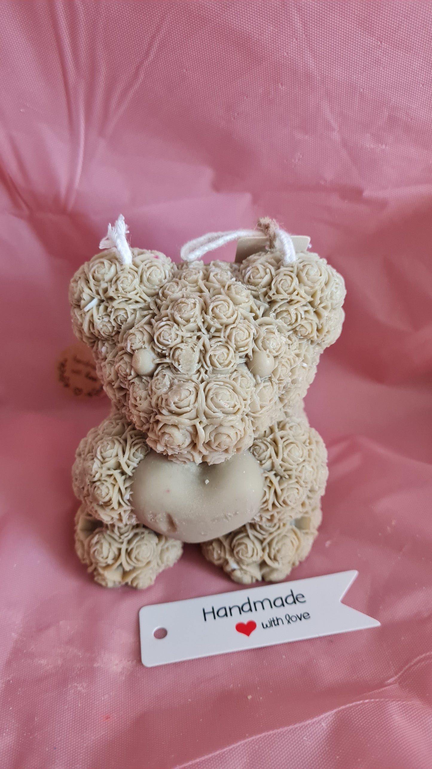 Teddy bear with a pattern of roses holding a heart in its paws (266g)