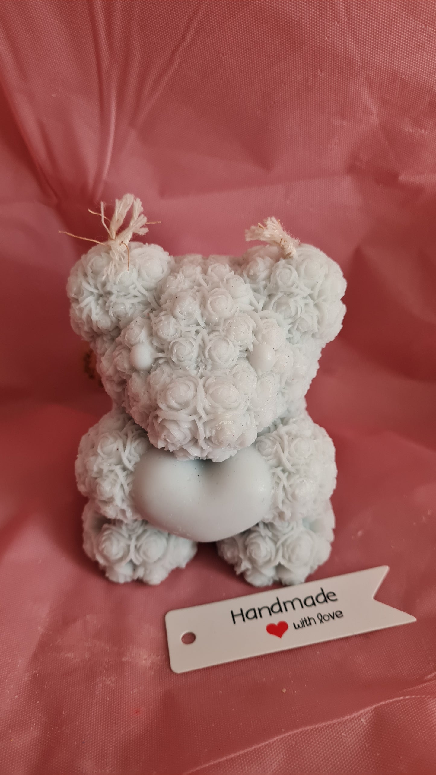 Teddy bear with a pattern of roses holding a heart in its paws (266g)