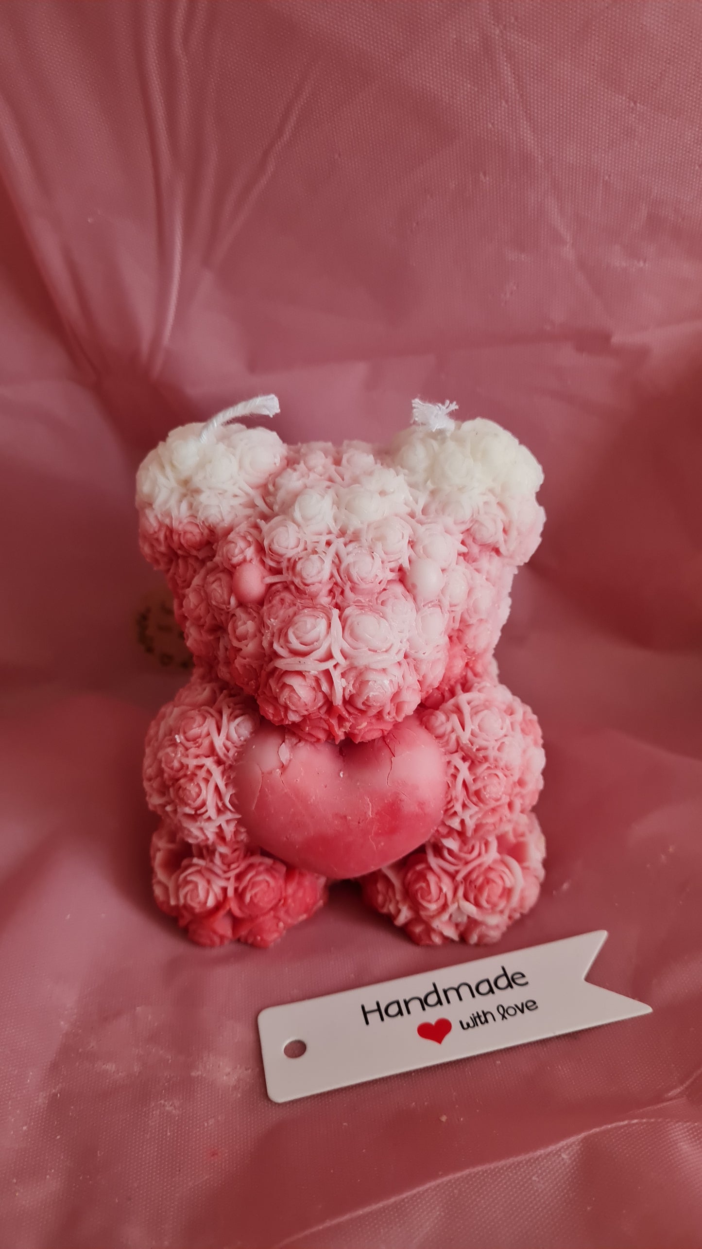 Teddy bear with a pattern of roses holding a heart in its paws (266g)