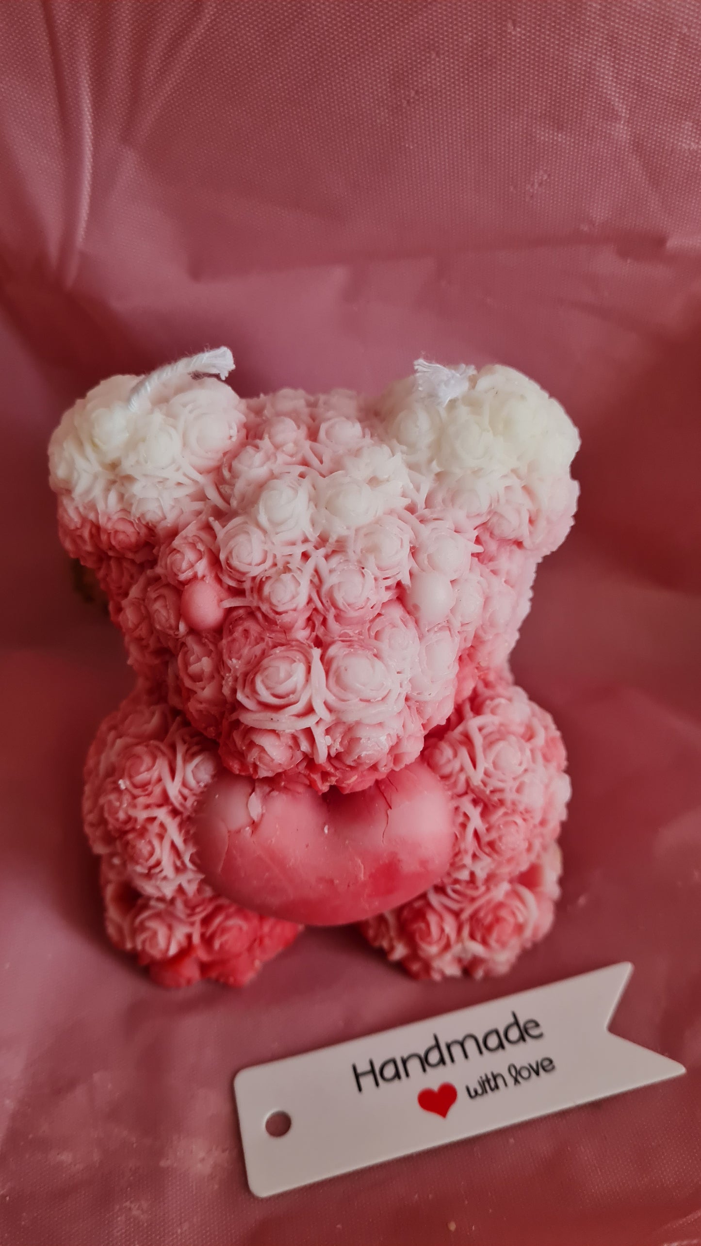 Teddy bear with a pattern of roses holding a heart in its paws (266g)