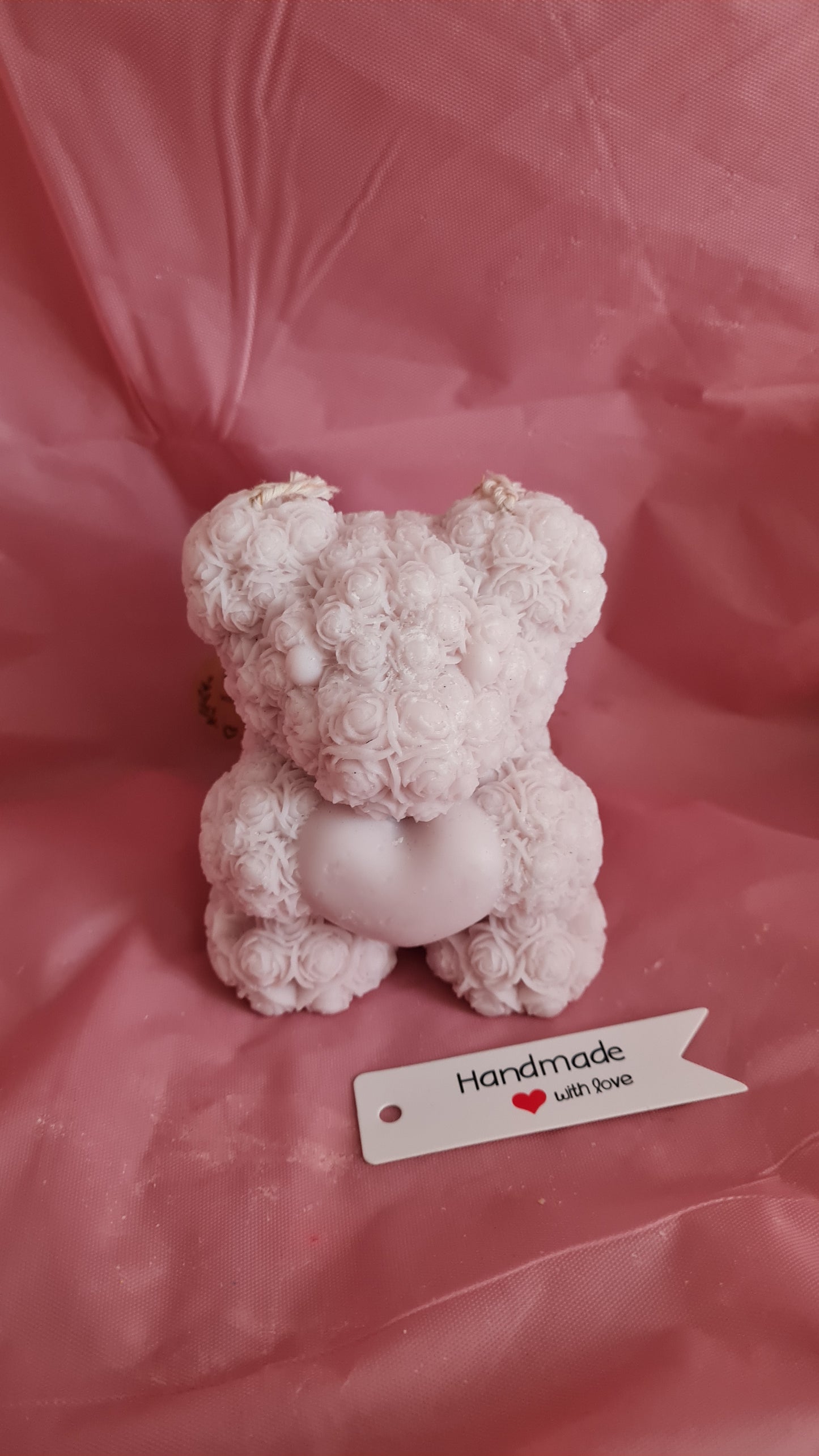 Teddy bear with a pattern of roses holding a heart in its paws (266g)